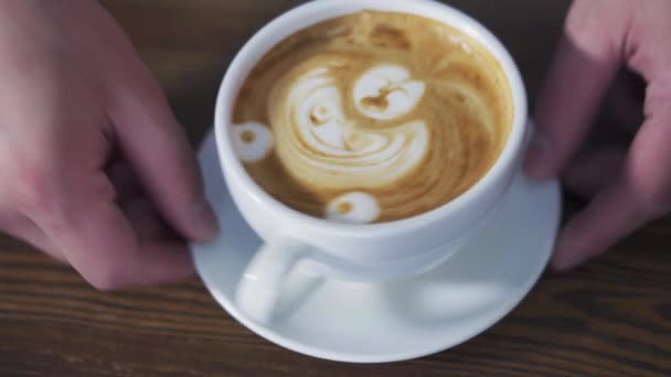 Man Hands Turning Cup Coffee Latte Art Show Drawing Form — Stock Video