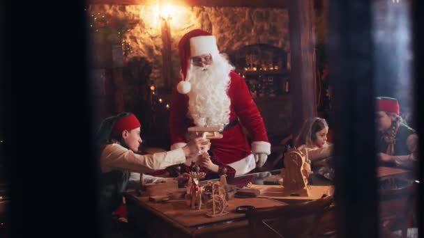 Santa Claus Elves Playing Children Wooden Toys While Sitting Table — Stock Video