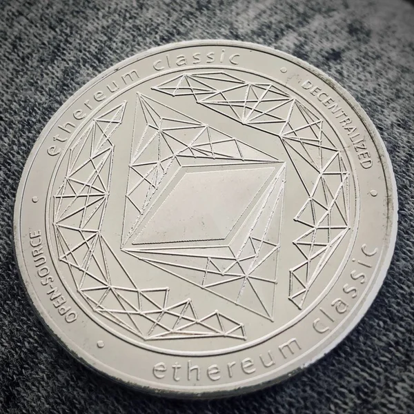 Digital currency physical metal silver ethereum coin. Cryptocurrency money concept.
