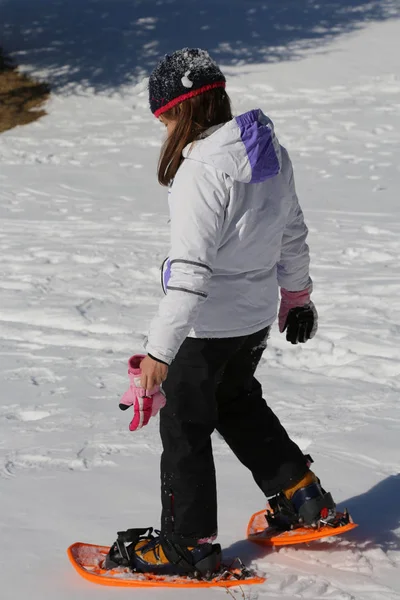 Little Girl Takes Steps Snowshoes Walking White Snow — Stock Photo, Image
