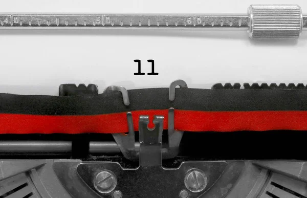 11 Number text written by an old typewriter on white sheet