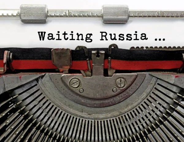 Waiting Russia text typed by hand on the old typewriter with black ink
