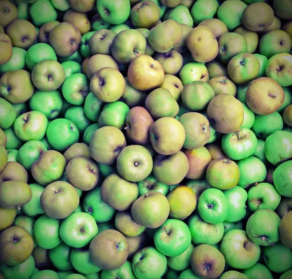 background of organic green apples for sale with vintage effect