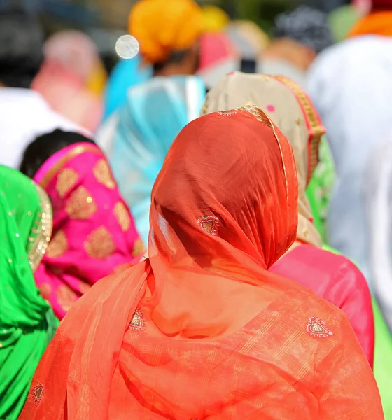 orange veil of a Sikh woman during a religious celebration