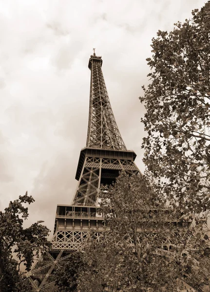 Eiffel tower from behind with sepia toned effect in Paris France