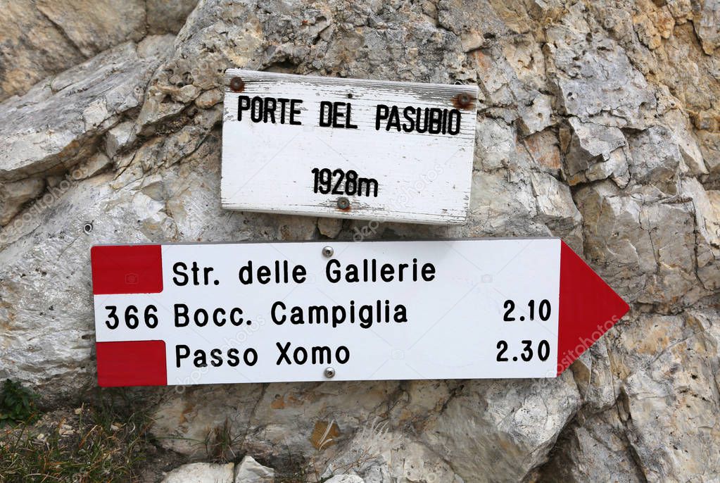Road sign of the mountain path  in Italian language to go to Pasubio Mountain. Porte del Pasubio means Doors of Pasubio Mount in Italian Language