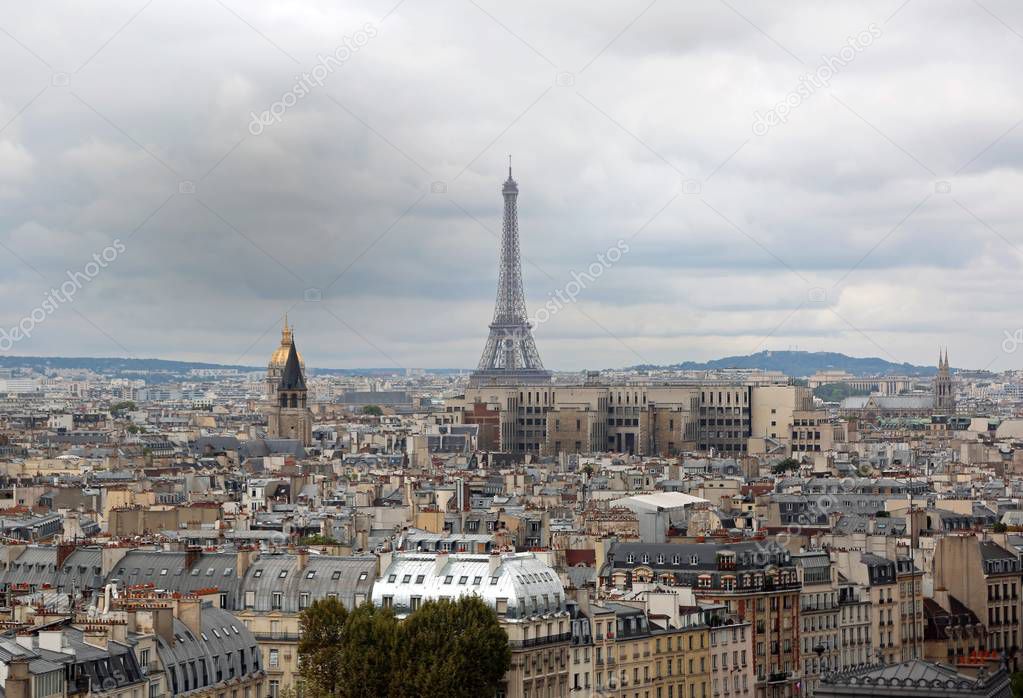 Panorama of Paris with Eiffel Tower  and golden Dome of Les Invalides from Basilica of Notre Dame