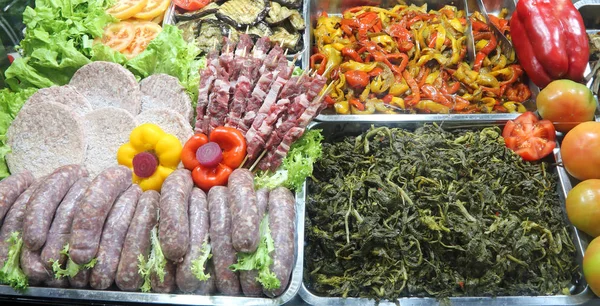 Trays Full Food Self Service Restaurant Many Sausages Spinach Peppers — Stock Photo, Image