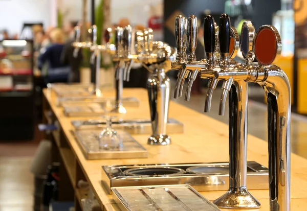 Many Draft Beer Taps Lined Counter Pub — Stock Photo, Image