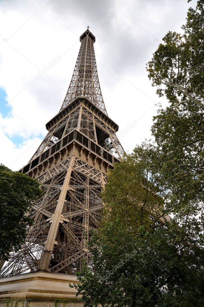 High Eiffel Tower in Paris France seen from Champ de Mars