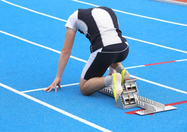 Muscular Athlete Starting Blocks Athletic Track — Stock Photo, Image