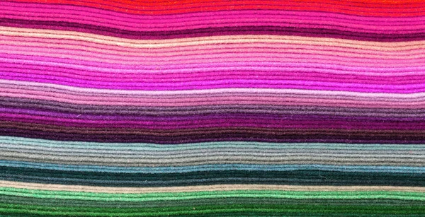 lines of fabric of many colors for sale in the haberdashery
