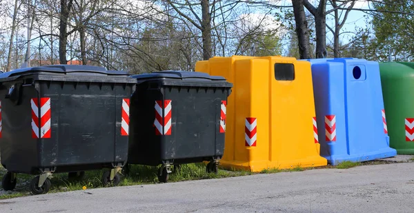 bins for waste paper collection and for the collection of used plastic and glass