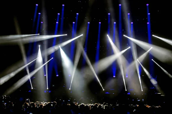 Lights and SpotLights on the stage during live concert with many people