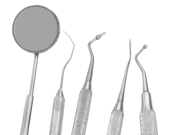 small Mirror and dental tool to remove tartar and more tools in the dental office