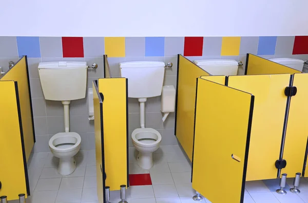 Small Toilets Adn Kindergarten Yellow Doors — Stock Photo, Image