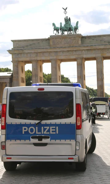 Berlin, Germany - August 19, 2017: German van near the Brandenburg Gate with the text POLIZEI which means Police in German language