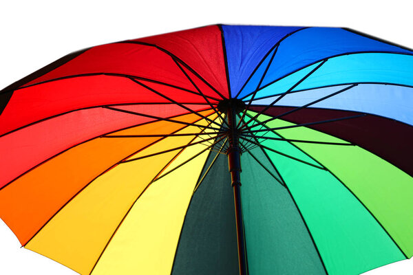 multicolored open umbrella with colorful wedges and white background