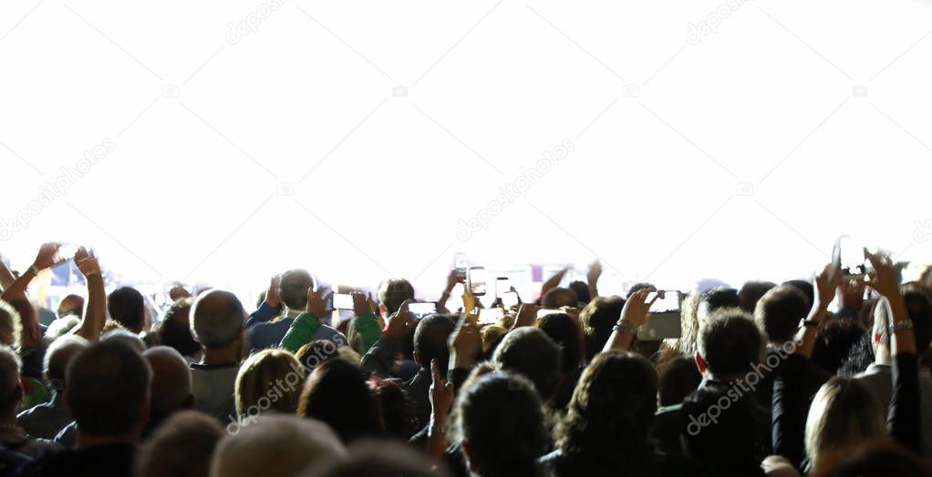 many people with smartphone during a live concert and customizable white background