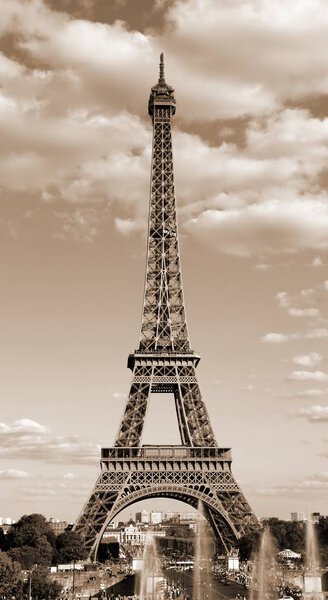 Eiffel Tower symbol of Paris in France in sepia toned effect with clouds