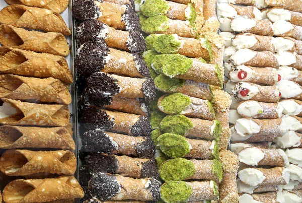 many pastries with fried dough with cream cheese for sale in Sicilian pastry