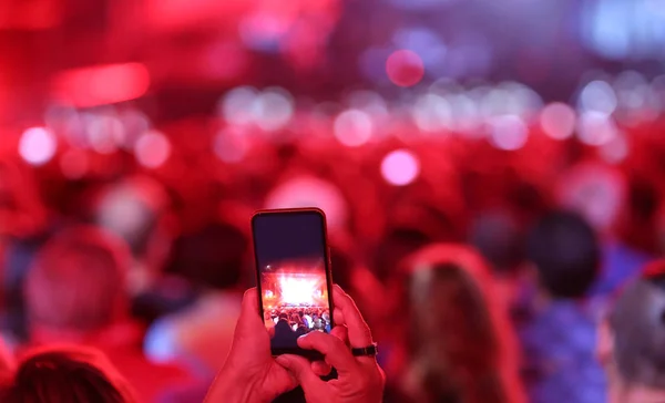 smartphone during a live concert with a lot of people