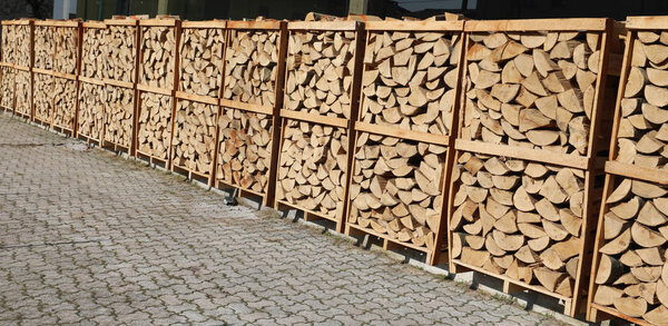 pallets with cut wood logs used for wood heating stoves