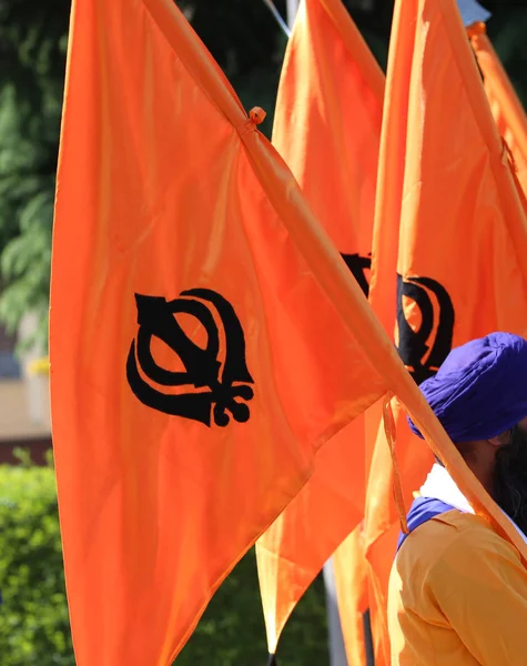 big orange flag and symbol of SIKH religion