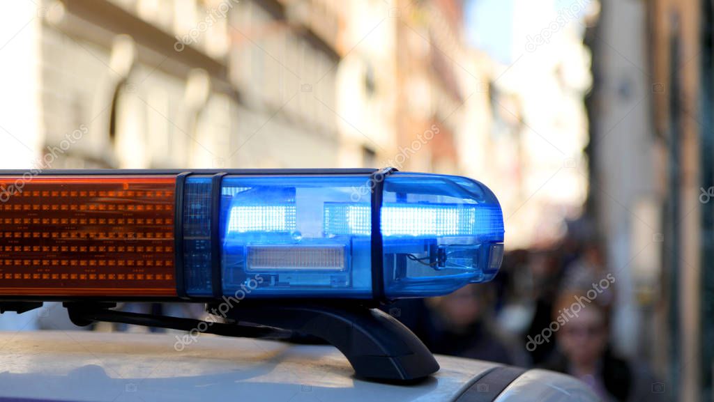 siren of a police patrol car at a roadblock for city security