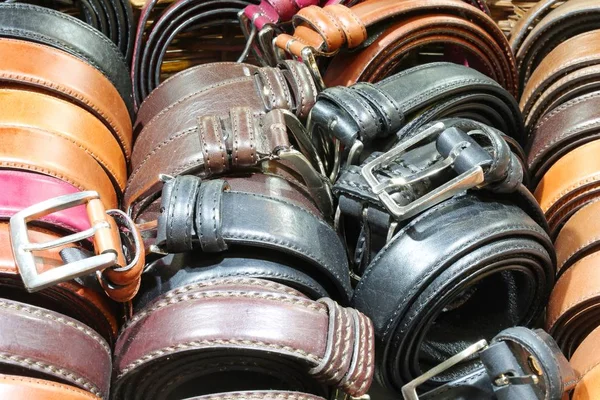 Many belts of leather for sale — Stock Photo, Image