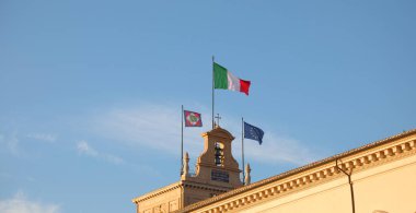 big Italian Flag and other two on the Quirinale Palace in Rome h clipart