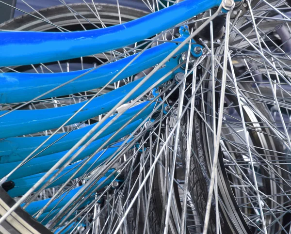 Bicycle spokes in a big parking lot — Stock Photo, Image