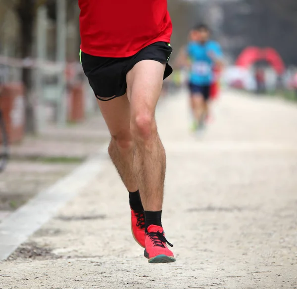 fast runner runs with red sport sneakers