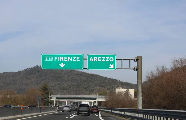 big road signs to Florence or Arezzo in Tuscany Region in Italy