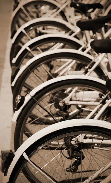 Bikes of the sharing bike system in the city with SEPIA effect — Stock Photo, Image