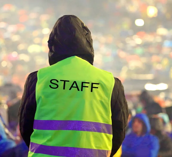 staff man with yello jacket