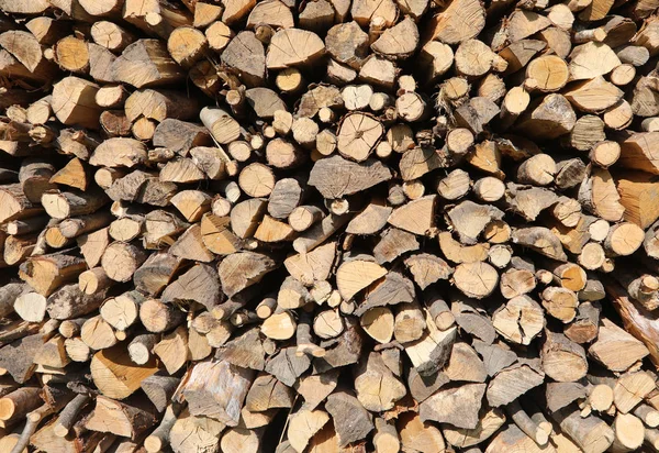 Fundo de pedaços empilhados de madeira — Fotografia de Stock