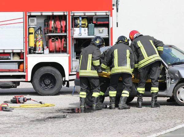 Firemen in action — Stock Photo, Image