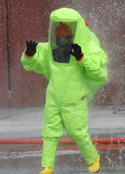 Man in the yellow protective suit — Stock Photo, Image