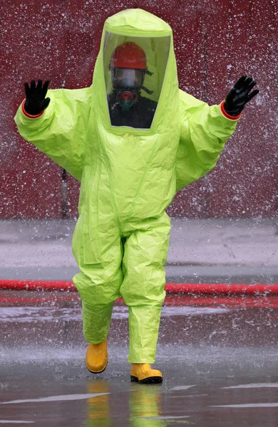 Man with yellow protective suit — Stock Photo, Image