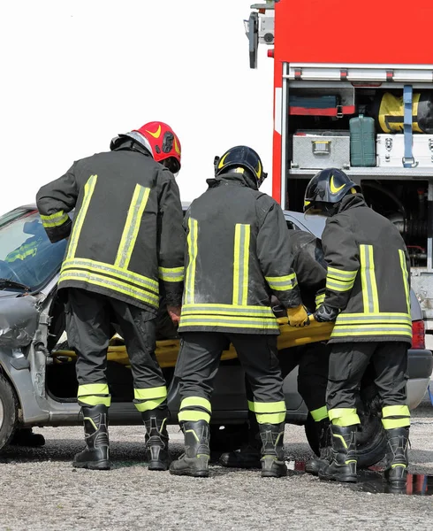 Team of firefighters in action — Stock Photo, Image