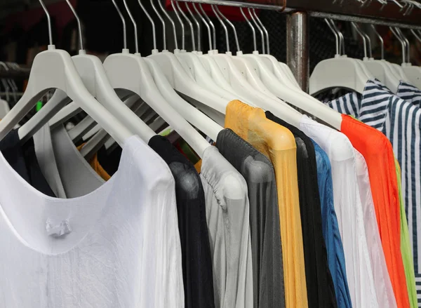 Stand of clothes for sale at outdoor market — Stock Photo, Image