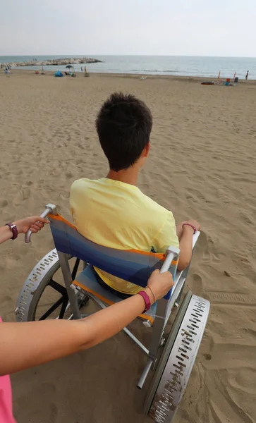 Young boy on the wheelchair — Stock Photo, Image