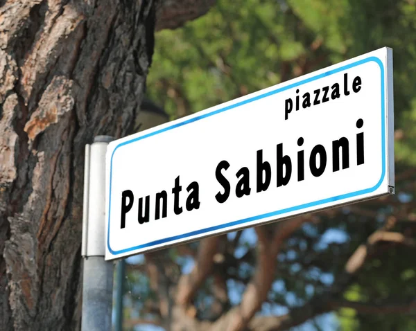 Road Sign with text PUNTA SABBIONI a famous sea place in Norther — Stock Photo, Image