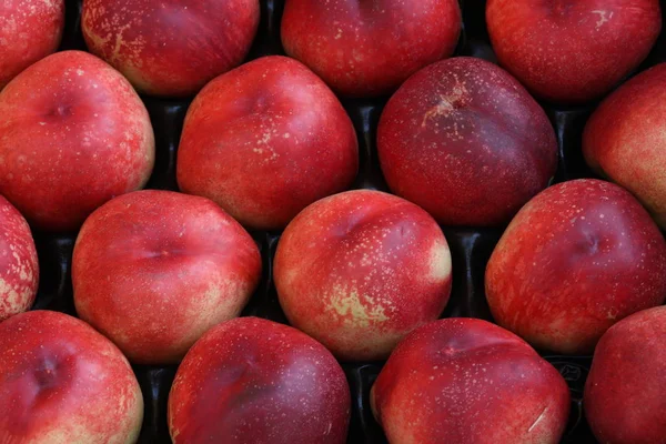 Bakgrund av mogna persikor — Stockfoto