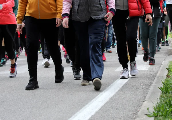 people walk down the street during a demonstration in the city