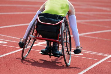 Athlete runs with wheelchair clipart
