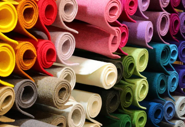 Background of many rolls of colored felt — Stock Photo, Image