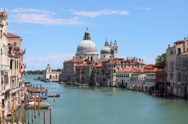 Exceptional typical view of the Island of Venice in Italy with the Grand Canal and the Dome of the Church called Madonna della Salute in Italy with few boats due to the lockdown caused by the Coronavirus clipart