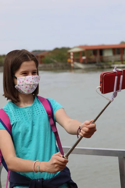 Girl Surgical Mask Because Corona Virus Takes Selfie Smart Phone — Stock Photo, Image